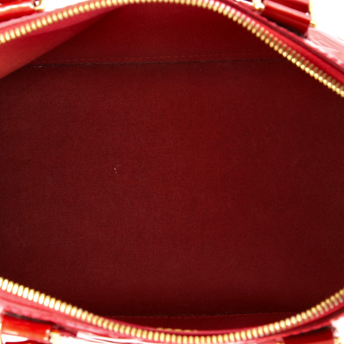 Alma Handbag Monogram Vernis PM