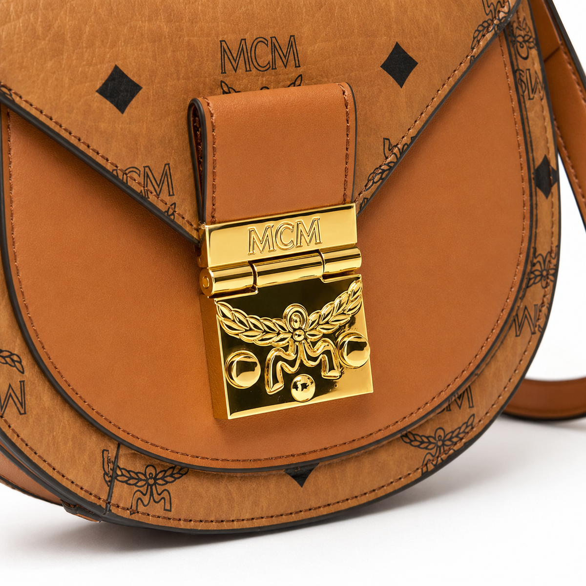 MCM Patricia Visetos Mini Saddle Bag – Cognac Monogram, Gold Hardware